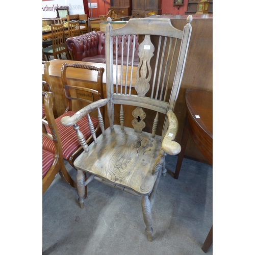 152 - A 19th Century elm and beech comb-back Windsor chair