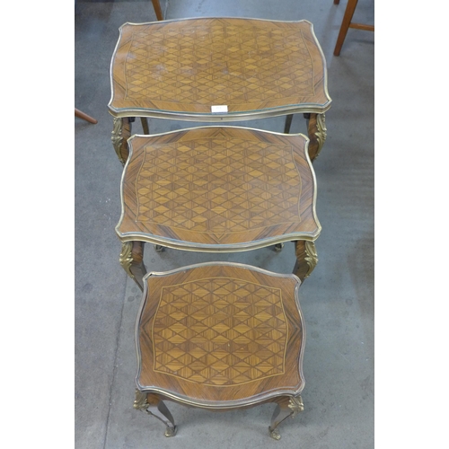 153 - A late 19th/early 20th Century French parquetry inlaid rosewood and gilt mounted nest of tables