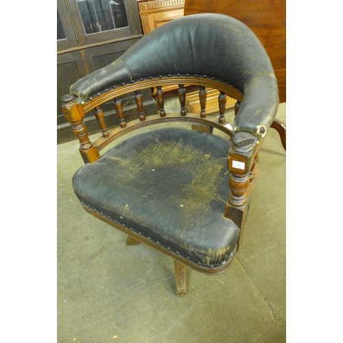 181 - A Victorian oak and upholstered revolving Captain's desk chair