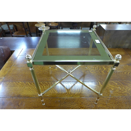 188 - An Italian brass and glass topped coffee table