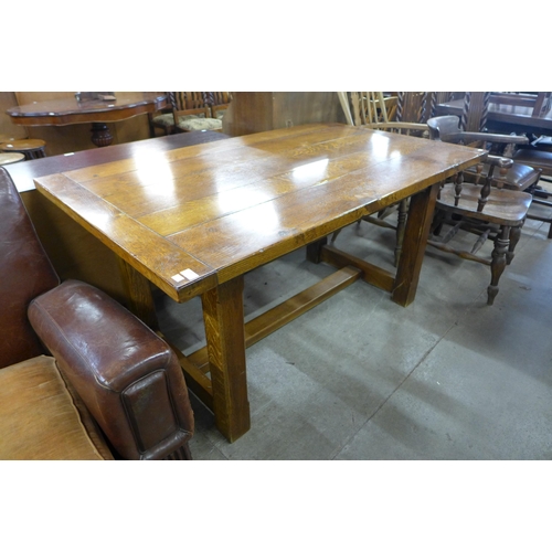 189 - An Arts and Crafts style oak refectory table