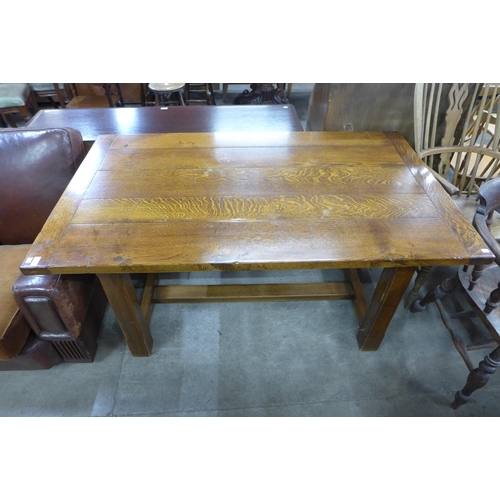 189 - An Arts and Crafts style oak refectory table