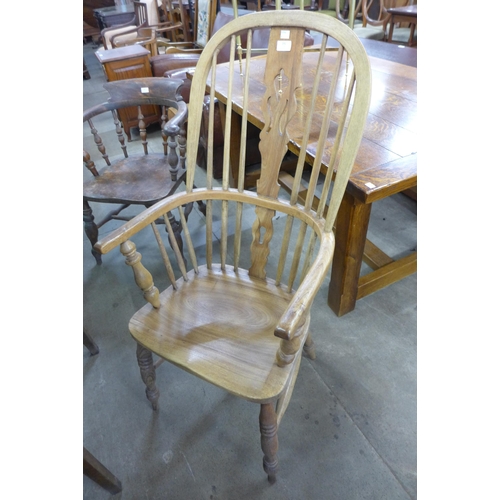 191 - A Victorian elm and beech highback Windsor armchair