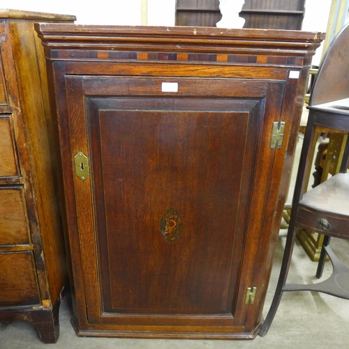 207 - Two George III oak wall hanging cupboards