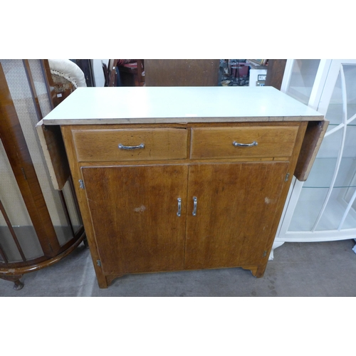 209 - A vintage oak and Formica topped kitchen cabinet