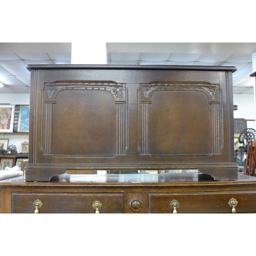 212 - An oak blanket box and an oak barleytwist sideboard