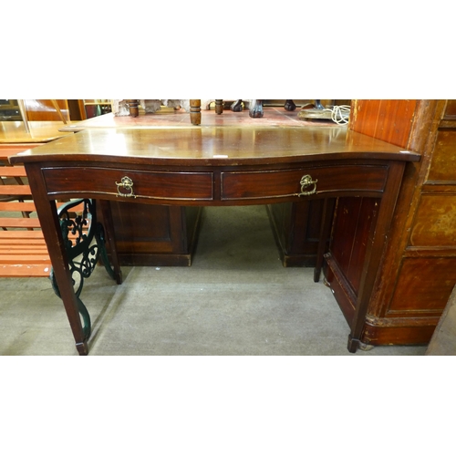 220 - An Edward VII mahogany two drawer serpentine serving table