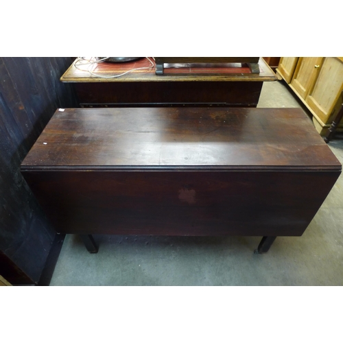 223 - A George III mahogany drop leaf table, an oak tripod table and an oak oval occasional table