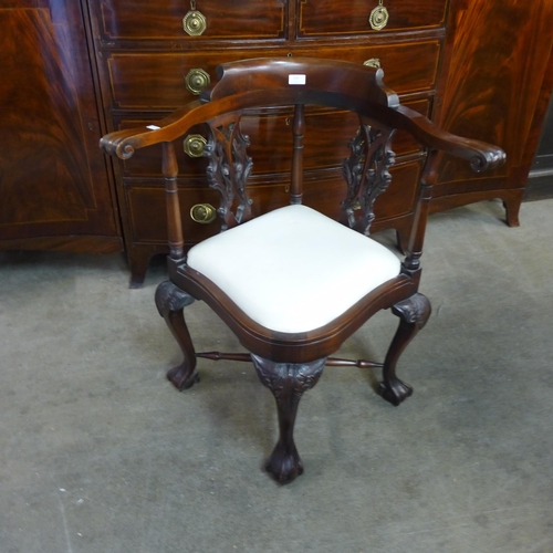 224 - A Chippendale style carved mahogany corner chair