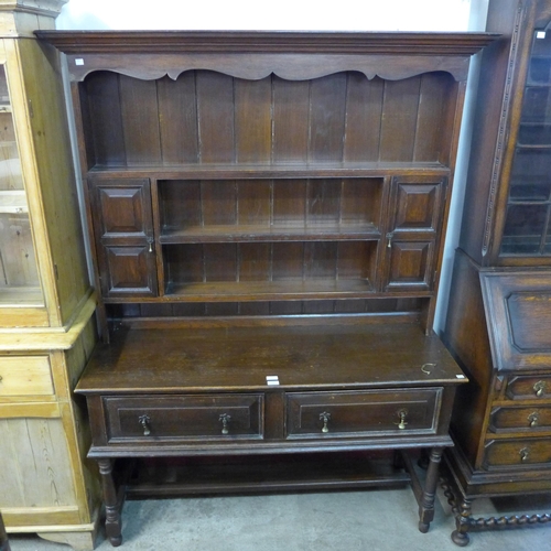 229 - A George II style oak dresser