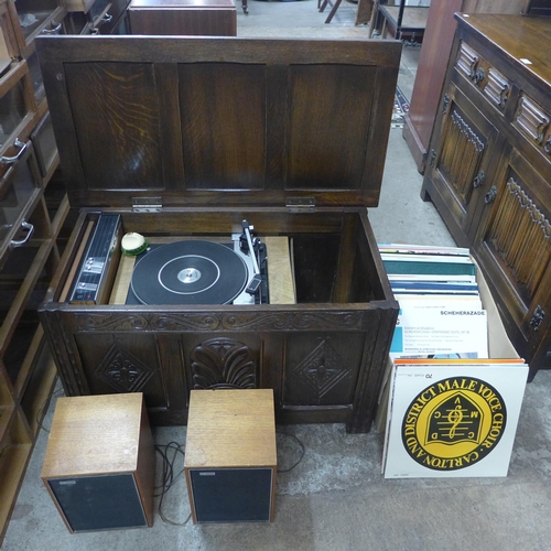 233 - An oak cased Philips turntable, with amplifier and speakers