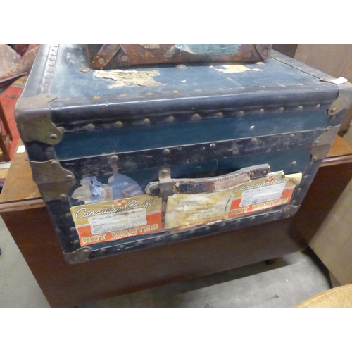 240 - A vintage steamer trunk and two briefcases