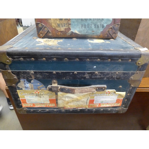 240 - A vintage steamer trunk and two briefcases