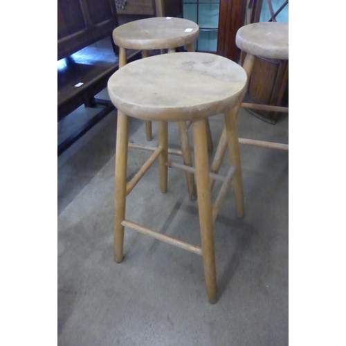 245 - A set of three elm and beech kitchen stools