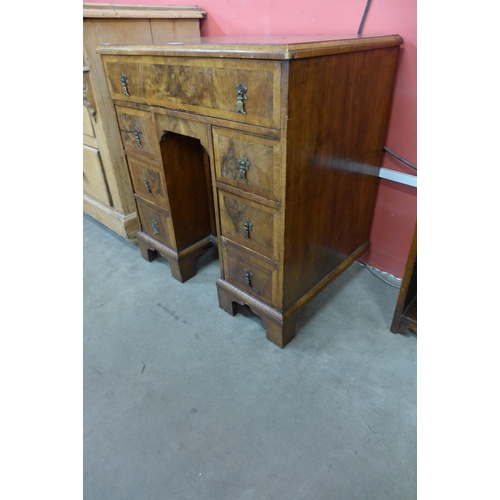 26 - A George I style walnut kneehole desk