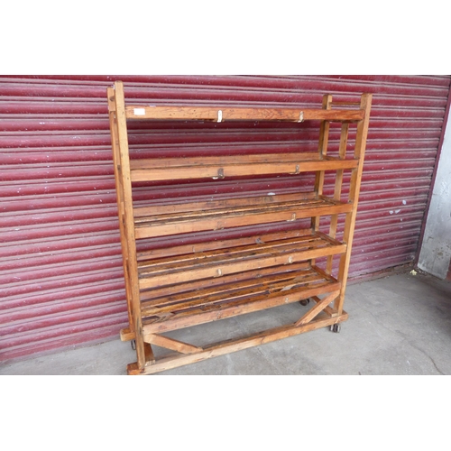 286 - A vintage pine shoe factory rack