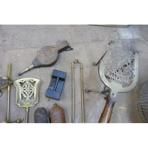 301 - A brass companion set, fire bellows, etc.