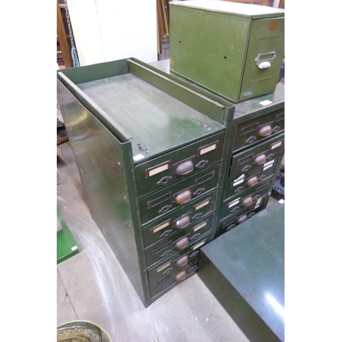 309 - Four sets of green metal industrial drawers