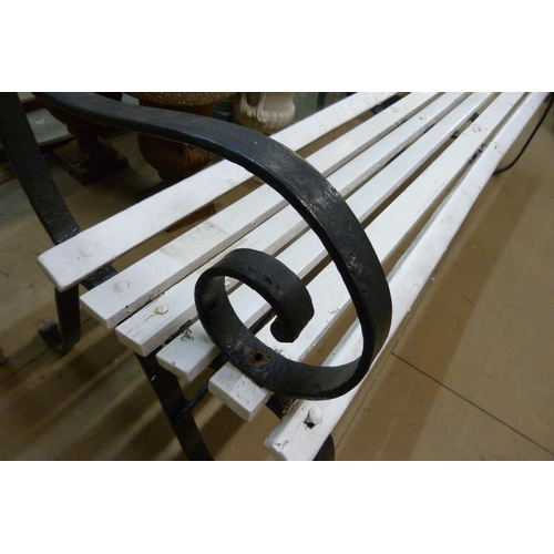 313 - A wrought iron ended garden bench