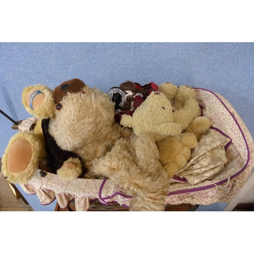 318 - A Victorian style doll's perambulator and assorted plush toys