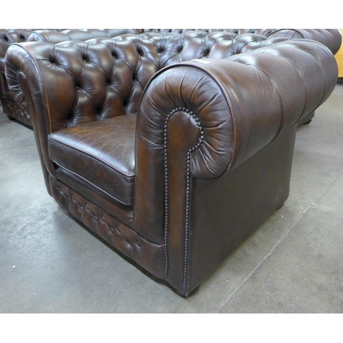 32 - A Thomas Lloyd chestnut brown leather Chesterfield club chair