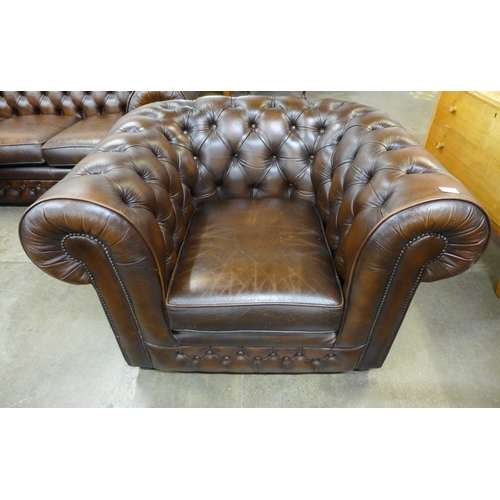 32 - A Thomas Lloyd chestnut brown leather Chesterfield club chair