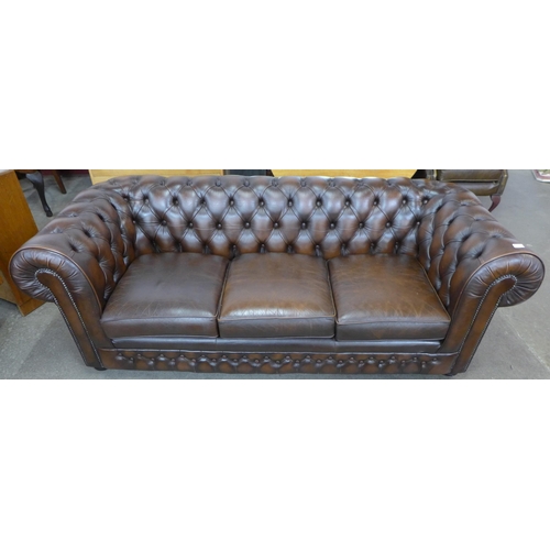 34 - A Thomas Lloyd chestnut brown leather Chesterfield settee