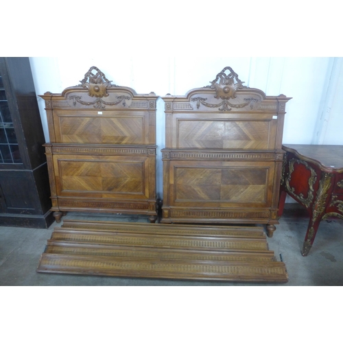 37 - A pair of 19th Century French carved walnut single beds