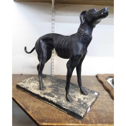 399 - A bronze effect figure of a greyhound