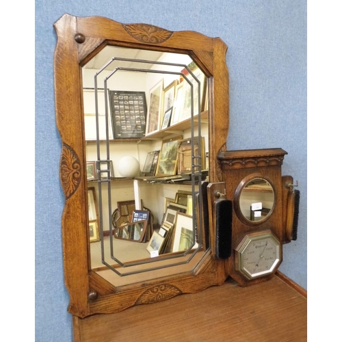 401 - An Art Deco oak aneroid barometer, mirror and brush set and an oak mirror