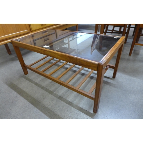 46 - A teak and glass top coffee table