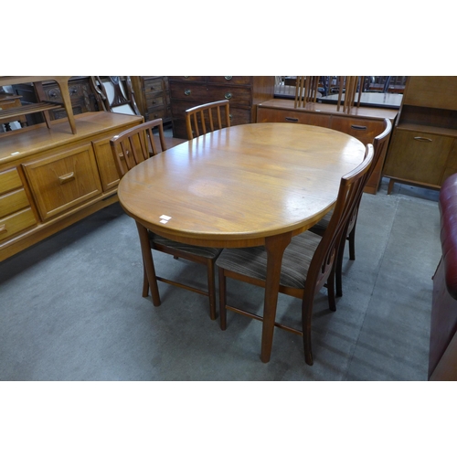 50 - A McIntosh teak extending dining table and four chairs