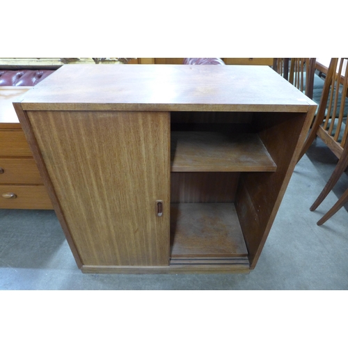 54 - A teak two door cupboard