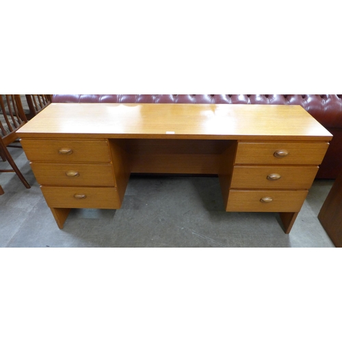 55 - An Austin Suite teak desk