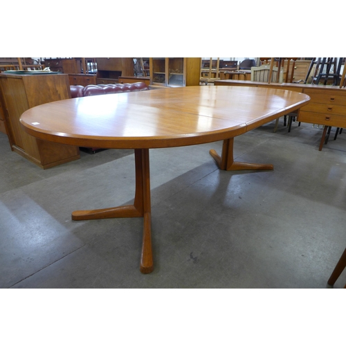 56 - A Danish teak extending dining table