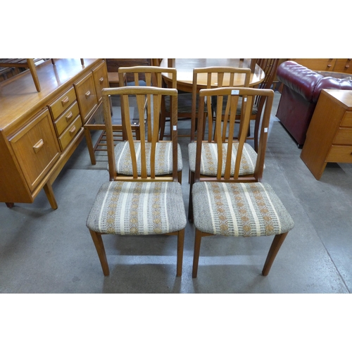 58 - A set of four teak dining chairs