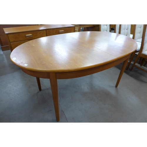 59 - A Jentique teak extending dining table