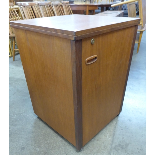 63 - A teak metamorphic home office desk/cabinet