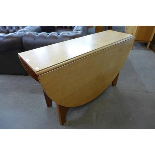 78 - A teak drop-leaf table and four chairs