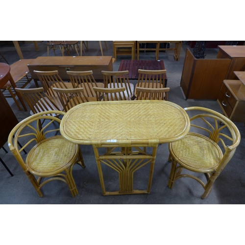 88 - A bamboo and rattan table and two chairs