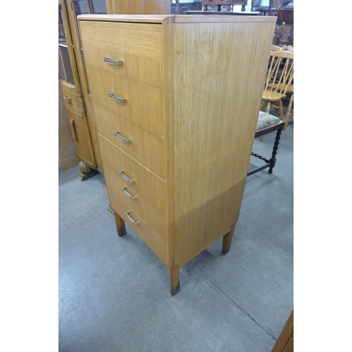 92 - A teak chest of drawers