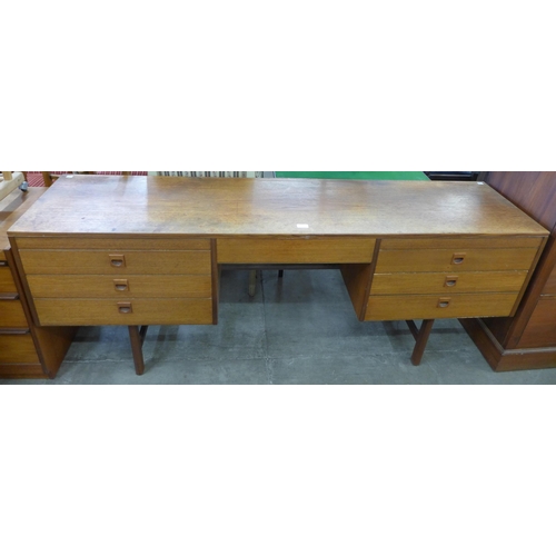 95 - An Alfred Cox teak desk