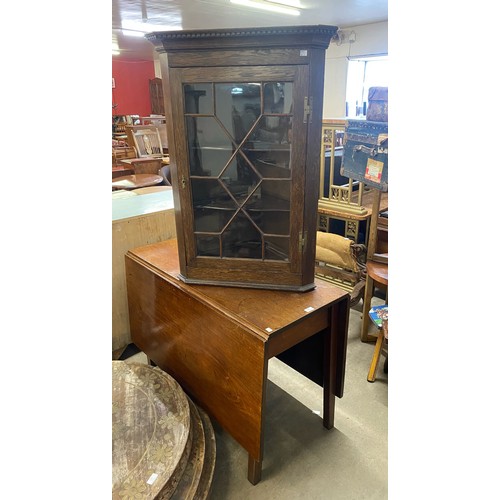 238 - A George III mahogany drop-leaf table and an oak splay front wall hanging corner cabinet