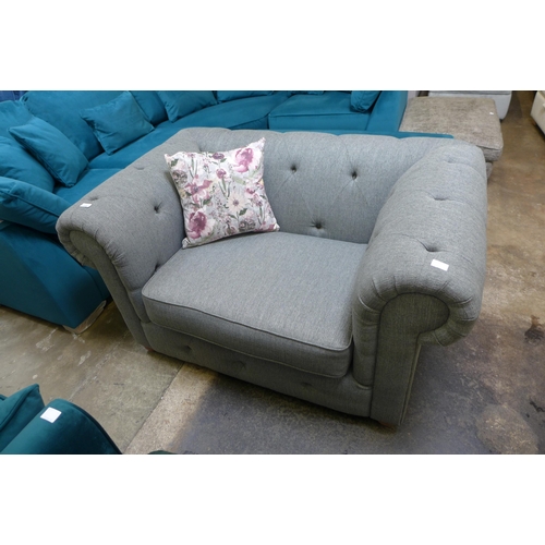 1320 - A pebble grey fabric Chesterfield style love seat