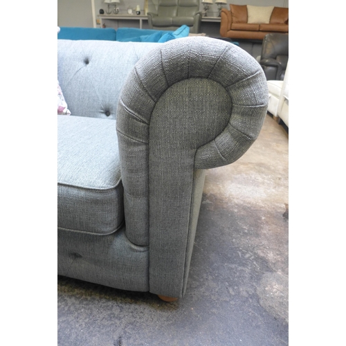 1320 - A pebble grey fabric Chesterfield style love seat