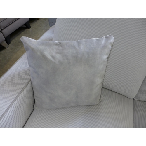 1328 - A frost white with grey piping corduroy upholstered two seater sofa