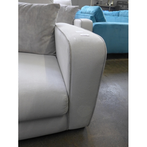 1329 - A frost white with grey piping corduroy upholstered two seater sofa