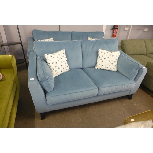 1343 - A diamond blue velvet 2.5 seater sofa with floral scatter cushions