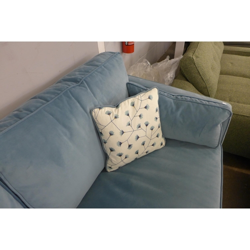 1344 - A diamond blue velvet three seater sofa with floral scatter cushions