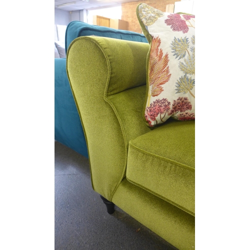 1345 - An apple metallic upholstered four seater sofa